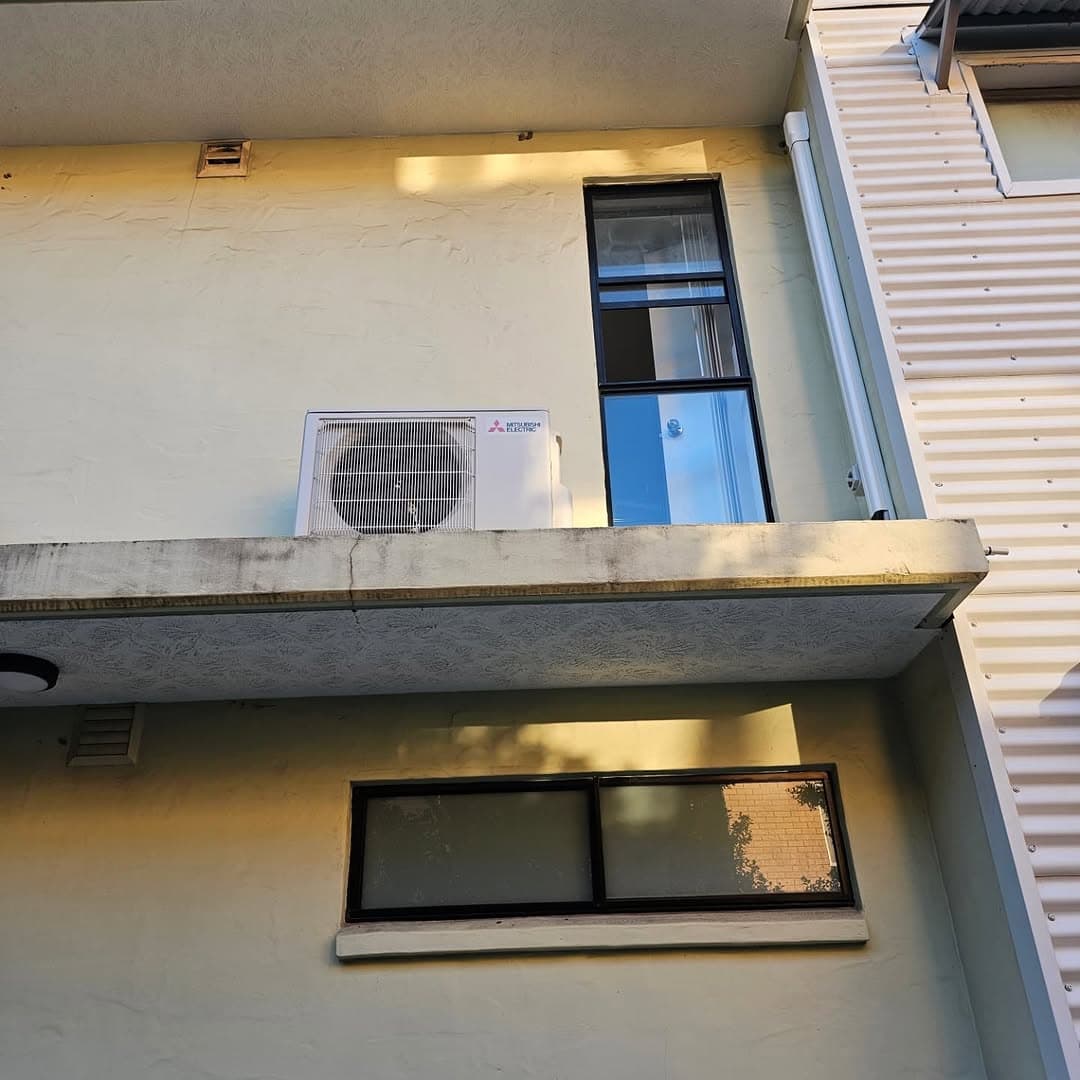 Mitsubishi Electric split system outdoor unit — Brisbane home